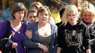 Grieving family members show their emotion after being told that a second explosion occurred in the Pike River Coal Mine.