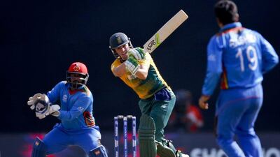 South Africa's AB de Villiers, centre, bats against Afghanistan during their ICC World Twenty20 2016 cricket match at the Wankhede stadium in Mumbai, India, Sunday, March 20, 2016. (AP Photo/Rajanish Kakade)
