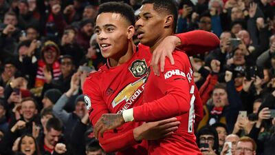 Marcus Rashford, right, celebrates with Mason Greenwood after scoring in United's 4-1 league win over against Newcastle in December. AFP