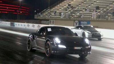 A Porsche pulls ahead in a qualifying race for the Yas Super Street Challenge at Yas Marina. Delores Johnson / The National