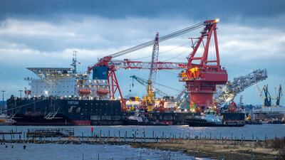 Tugboats get into position on the Russian pipe-laying vessel Fortuna in the port of Wismar, Germany in January. Prices for electricity and natural gas are surging in Europe. AP Photo