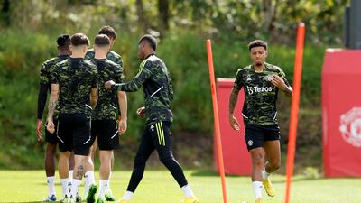 Manchester United's Jadon Sancho trains with teammates at Carrington. Reuters