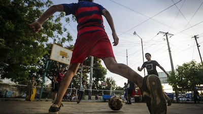 Kids play football in a neighbourhood of Managua, on January 13, 2016. Football is gaining enthusiasts in Nicaragua where baseball has been historically dominant but is now giving way to the new sport, analysts said. Inti Ocon / AFP