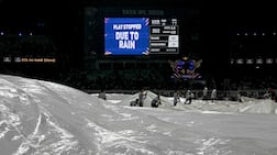 Groundsmen cover the pitch as rain halts play during the IPL match between Kolkata Knight Riders and Punjab Kings at the Eden Gardens. AFP