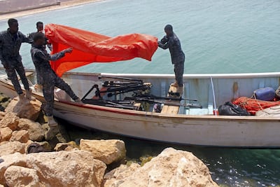 Somali Puntland forces uncover weapons seized in a boat on the shores of the Gulf of Aden in the city of Bosasso, Puntland region, Somalia. Abdiqani Hassan / Reuters