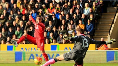 Roberto Firmino of Liverpool scores his team’s first goal on Saturday against Norwich City. Stephen Pond / Getty Images