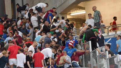 Supporters clash in the stands after the UEFA EURO 2016 group B preliminary round match between England and Russia at Stade Velodrome in Marseille, France. Daniel Dal Zennaro / EPA