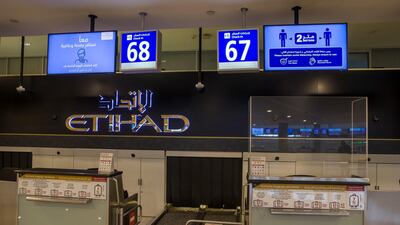 Plastic barriers around the check in area protecting both staff and passengers. Courtesy of Etihad Airways