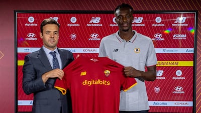 Tammy Abraham alongside general manager Tiago Pinto.