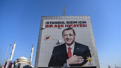 A poster of President Recep Tayyip Erdogan for the upcoming Turkish local elections hangs in Istanbul, reading "Istanbul is a love story for us". AFP
