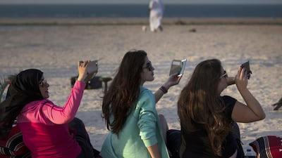 Visitors make sure to record every moment during a falcon show, which are amongst the many activities offered to visitors on the Sir Bani Yas Island, one of the largest natural island in the UAE. Silvia Razgova / The National
