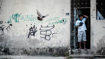 Popole Misenga, 24, a refugee judoka from the Democratic Republic of Congo, stands at the entrance of his flat in Rio de Janeiro, Brazil. Misenga is a strong candidate for the Refugees Olympic Athletes team for the 2016 Olympic Games. Yasuyoshi Chiba / AFP Photo