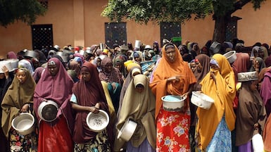 Women waiting for aid in Somalia, one of the countries most severely affected by 'catastrophic' cut to overseas aid, a charity chief has told The National. AFP