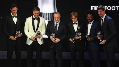Left to right: Real Madrid's Raphael Varane, Sergio Ramos, club president Florentino Perez, Luka Modric, Marcelo and goalkeeper Thibaut Courtois pose with their awards during the Best FIFA Football Awards 2018 in London. EPA