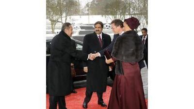Qatar's Emir, Sheikh Hamad bin Khalifa al Thani, centre, his wife, Sheikha Mozah Bint Nasser al Missned, and Qatar's prime minister, Sheikh Hamad bin Jassim bin Jabr al Thani, left, are welcomed in Zurich by Fifa's secretary general Jerome Valcke, second from right. Christian Hartmann / Reuters