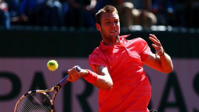 Jack Sock of the United States returns a shot in his men's singles match against Borna Coric of Croatia on Day 7 of the 2015 French Open at Roland Garros on May 30, 2015 in Paris, France. (Photo by Dan Istitene/Getty Images)