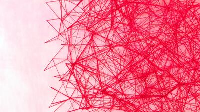 A room by the Japanese artist Chiharu Shiota is suffused, ecstatically, maniacally, with red threads, which threaten to consume a weathered dhow that sits in the centre of the room. Photo: Reem Mohammed / The National