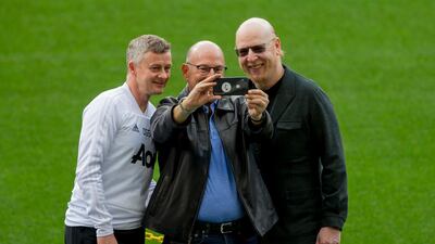 Manchester United's manager Ole Gunnar Solskjaer, left, takes a selfie with club owners Joel Glazer, centre, and Avram Glazer. AP Photo