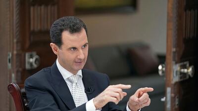 In this photo, released May 10, 2018 by the Syrian official news agency SANA, Syrian President Bashar Al Assad speaks during an interview with the Greek Kathimerini newspaper, in Damascus, Syria. AP
