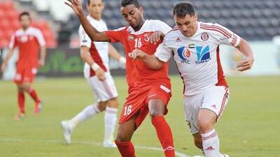 Al Jazira striker Bare, right, scored two goals in the home win against Emirates.
