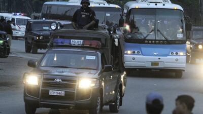 Police escort the Zimbabwean cricket team to their hotel in Lahore on Tuesday. Zimbabwe are the first Test playing nation to visit Pakistan in more than six years. KM Chaudary / AP