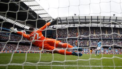 Leeds United keeper Joel Robles dives as Manchester City's Ilkay Gundogan misses from the penalty spot. Reuters