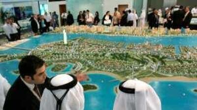 Prospective investors look over Sorouh real estate's master plan for LuLu Island at Cityscape Abu Dhabi last year. Most experts stress extensive research into the developer's history before you seriously consider an investment. Exercising due diligence will help ensure the lasting value of your property.