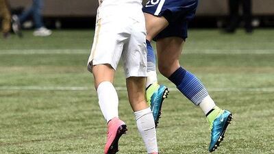 NEW ORLEANS, LA - DECEMBER 16: Abby Wambach #20 of the United States is defended by Li Ying #10 of China during the first half of the women's soccer match at the Mercedes-Benz Superdome on December 16, 2015 in New Orleans, Louisiana. Stacy Revere/Getty Images/AFP== FOR NEWSPAPERS, INTERNET, TELCOS & TELEVISION USE ONLY ==