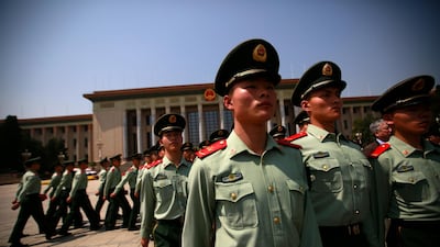 Chinese paramilitary officers march outside the Great Hall of the People after an event celebrating the 200th year anniversary of the birth of German philosopher Karl Marx in Beijing, China. Since coming to power in 2012, Xi, widely seen as the most powerful Chinese leader since Mao Zedong, has said the party must not forget its socialist roots as it works to attain the "great rejuvenation of the Chinese nation". How Hwee Young / EPA