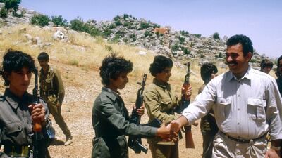 Kurdistan Workers' Party (PKK) leader Abdullah Ocalan greets women soldiers at the Mahsun Korkmaz Academy military training camp in Lebanon on June, 18, 1988. Getty Images