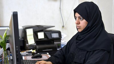 Nassima Al Sadah, a candidate for municipal councils in Qatif, Saudi Arabia, working at her office. AFP Photo