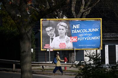 A billboard showing European Commission President Ursula von der Leyen and Alexander Soros, son of Hungarian-US billionaire George Soros, with the slogan 'Let's not dance to their tunes! National consultation' in Budapest. AFP