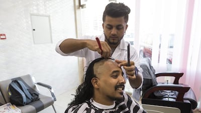 After two years of growing his hair, Indian Tarun Kurian Thomas donated his locks to the Hair for Hope initiative to be made into a wig. Antonie Robertson / The National
