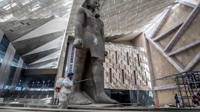 The 3,200-year-old pink granite statue of King Ramses II, at the entrance of the the Grand Egyptian Museum in Giza, on the south-western outskirts of Cairo. AFP