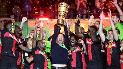 Xabi Alonso lifts the DFB-Pokal trophy after his team's German Cup final victory over Kaiserslautern. Getty Images
