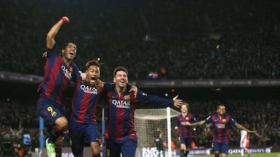 Barcelona's Luis Suarez, Neymar and Lionel Messi celebrate after Messi scores their third goal in a 3-1 La Liga win over Atletico Madrid on Sunday night at the Camp Nou. Albert Gea / Reuters