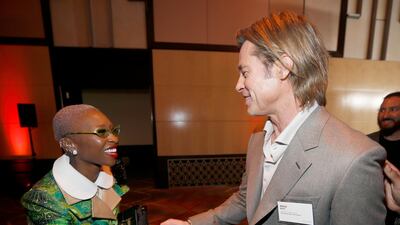 Cynthia Erivo shakes hands with Brad Pitt. AP