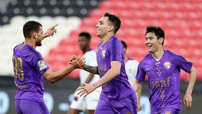 Al Ain forward Caio, centre, celebrates scoring. Chris Whiteoak / The National