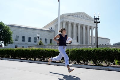 An intern runs to deliver the Supreme Court's ruling on birthright citizenship to the media. Reuters