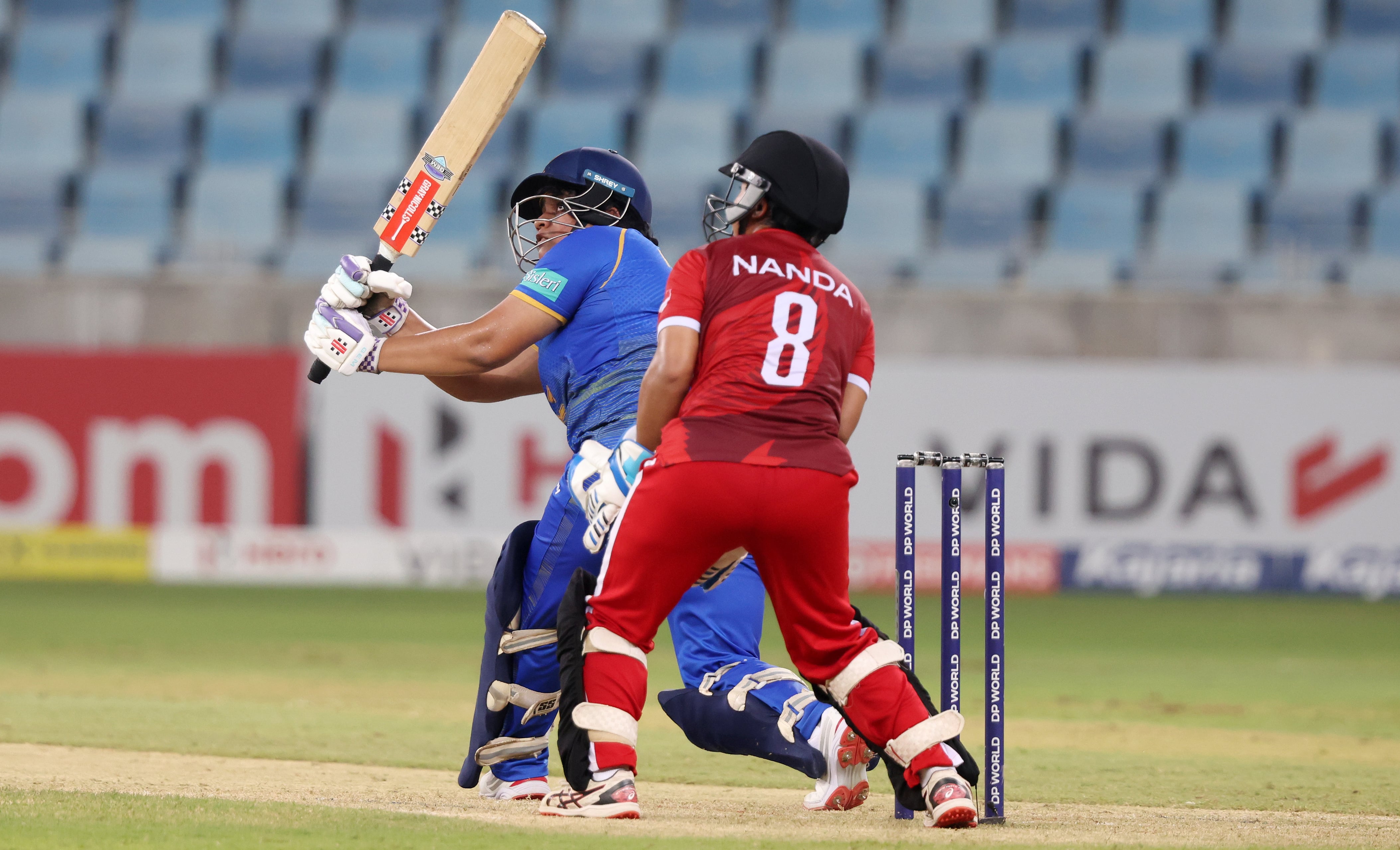 UAE's Rinitha Rajith hits a boundary at Dubai International Stadium