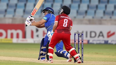 UAE's Rinitha Rajith hits a boundary