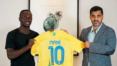 Al Nassr's Sadio Mane with club CEO Ahmed Alghamdi during his unveiling. Reuters