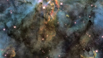 The Hubble captured chaotic activity at the top of a three-light-year-tall pillar of gas and dust that is being eaten away by light from bright stars nearby. Photo: Nasa