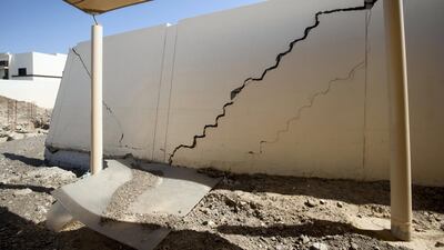 Cracks run through buildings following the flooding