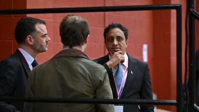 Zia Yusuf, chairman of Reform UK, speaks to members of his team as votes are counted in the Runcorn and Helsby by-election. Getty Images
