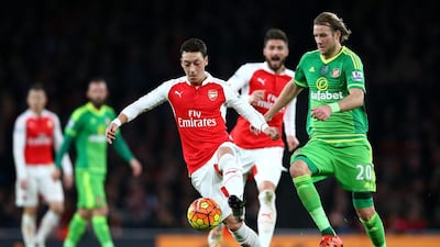 Mesut Ozil dug deep for Arsenal to help out the defence as well as assist the attack up front against Sunderland. Paul Gilham / Getty Images