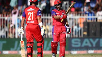 Virender Sehwag of Gemini Arabians celebrates his fifty on Friday in the Masters Champions League T20 match in Sharjah. Francois Nel / Getty Images