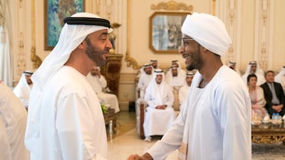 Sheikh Mohamed receives a member of the Young Arab Media Leaders Programme, during a Sea Palace barza. Hamad Al Kaabi / Ministry of Presidential Affairs
