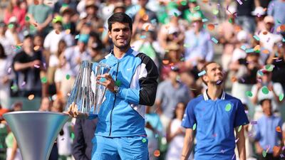 Carlos Alcaraz of Spain holds the Indian Wells Masters trophy after defeating Daniil Medvedev in the final. Getty Images