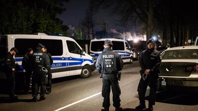 Police stand near the team hotel. Maja Hitij / Getty Images